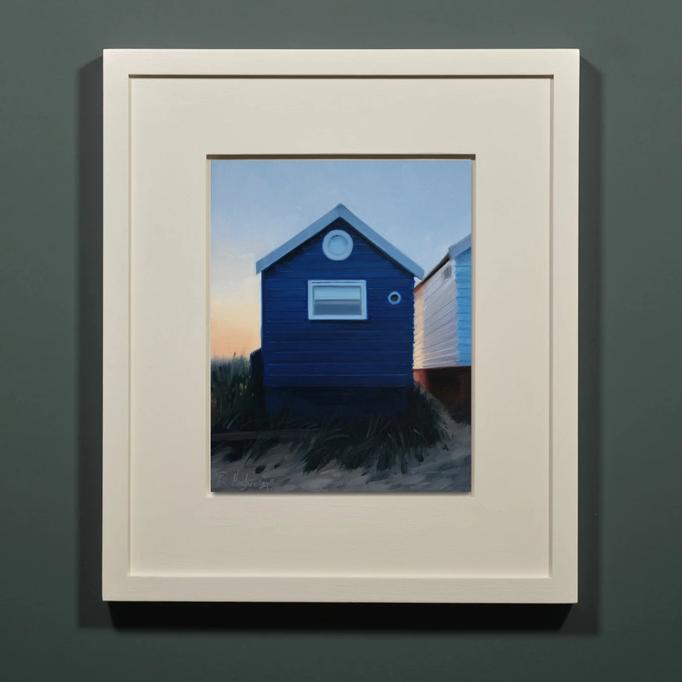 Back-lit dark blue hut with round windows framed.jpg