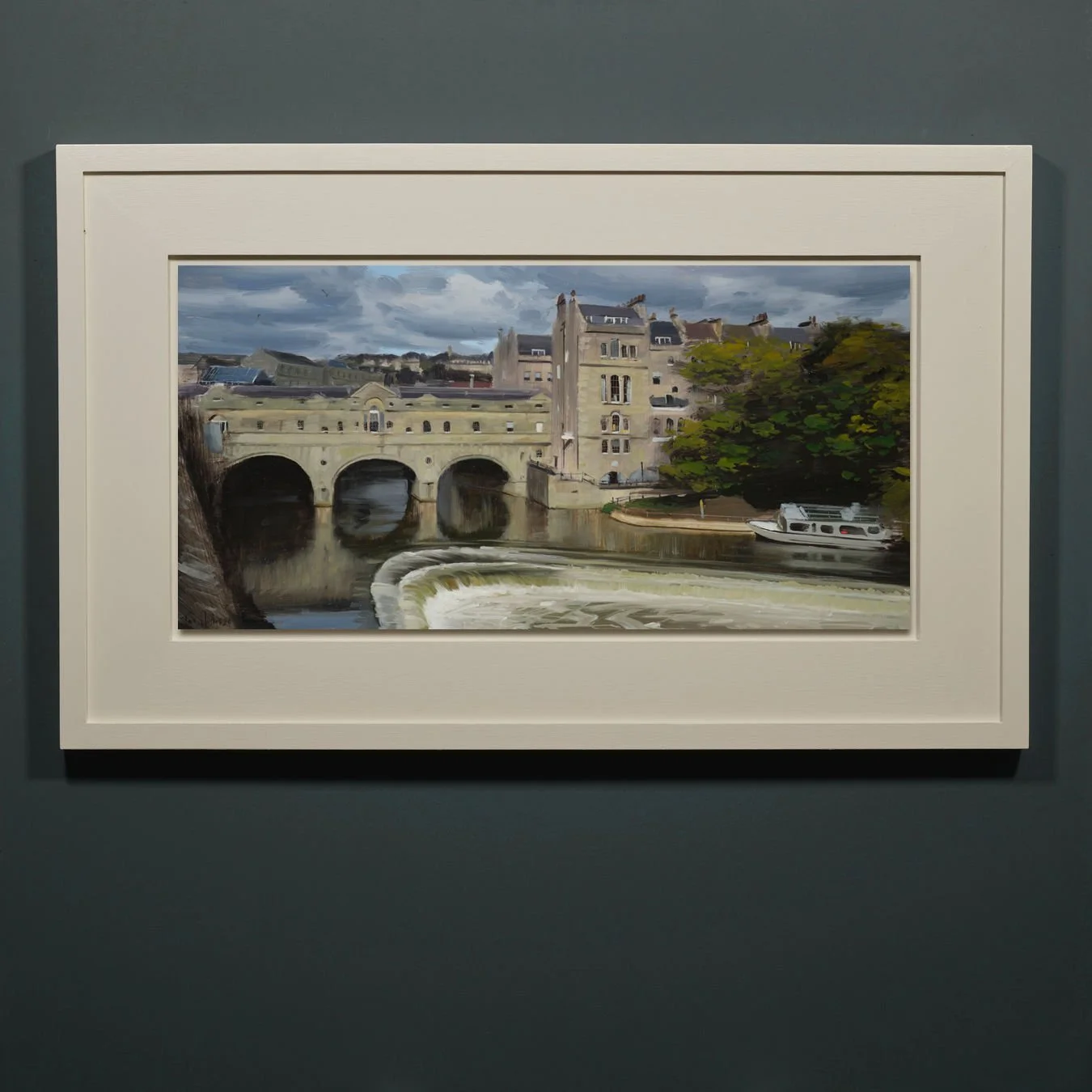 Pulteney Bridge in sun with rain clouds, Bath