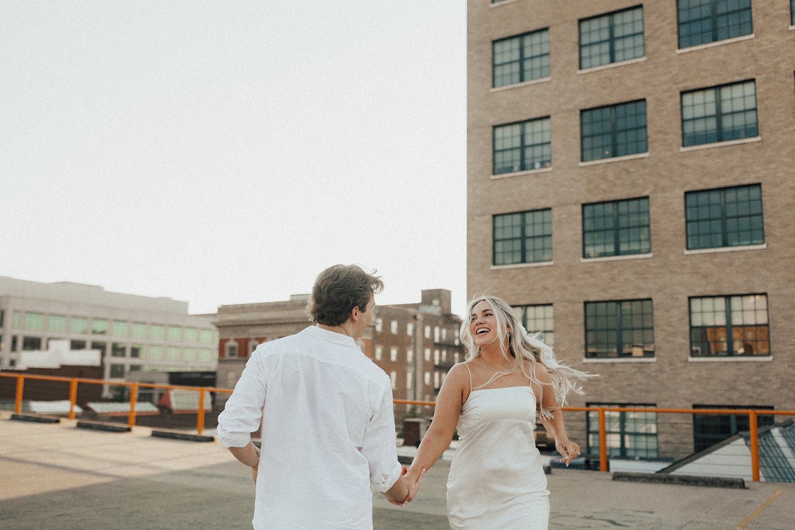 hannah-and-trey-parking-can-be-fun-downtown-memphis-river-walk-mississippi-beach-tennessee-wedding-photographer-jo-darling-photography-136.jpg