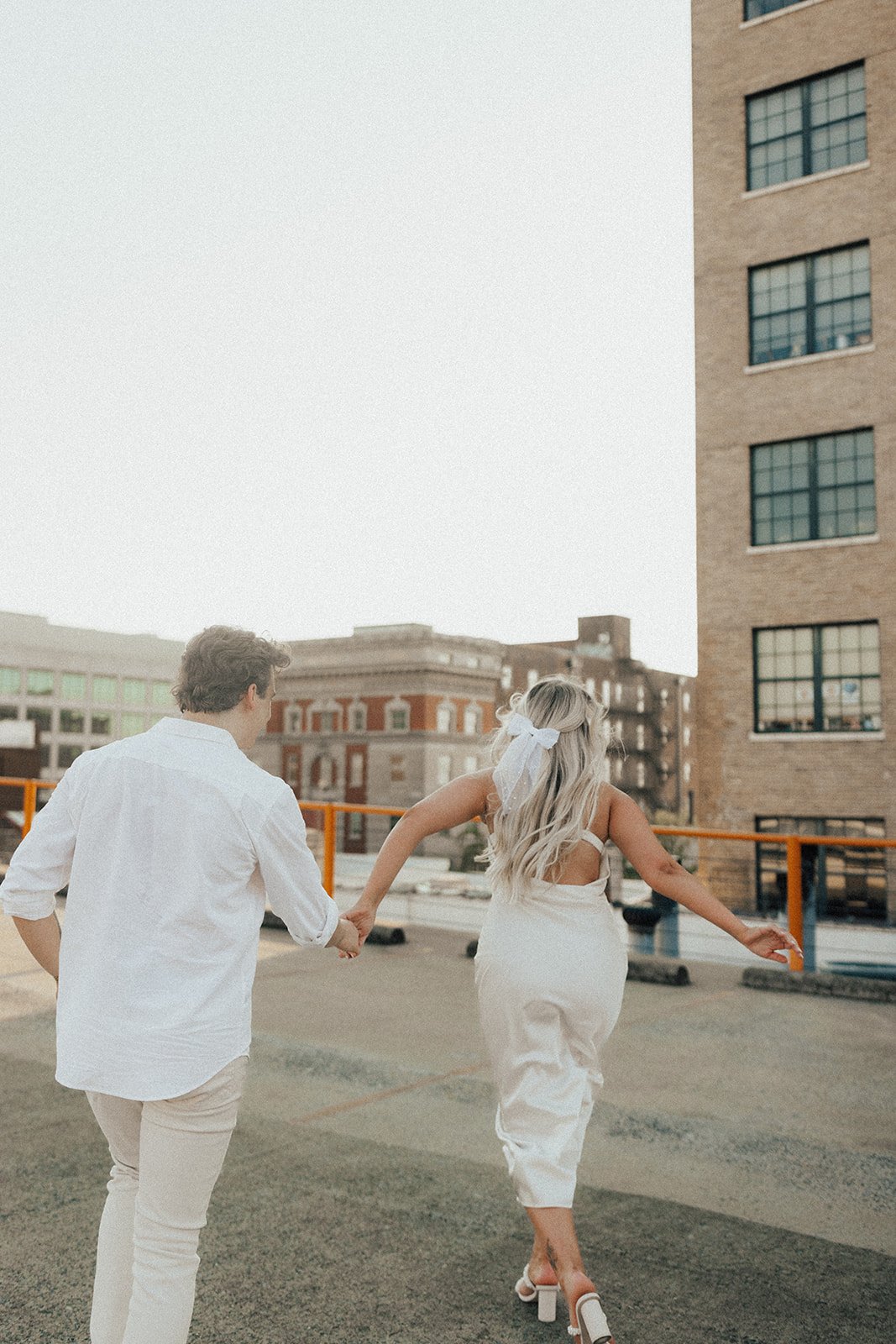 hannah-and-trey-parking-can-be-fun-downtown-memphis-river-walk-mississippi-beach-tennessee-wedding-photographer-jo-darling-photography-141.jpg