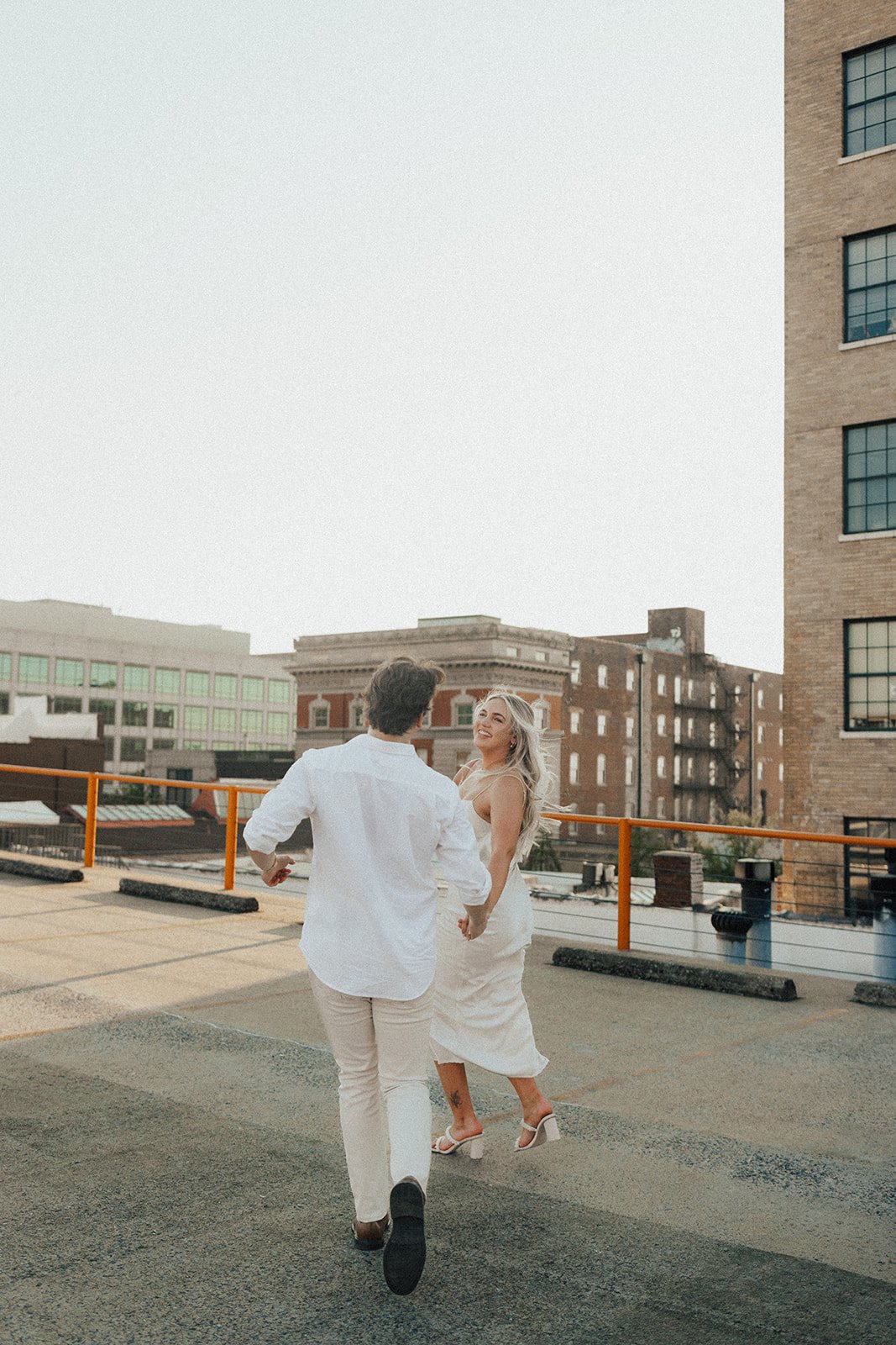 hannah-and-trey-parking-can-be-fun-downtown-memphis-river-walk-mississippi-beach-tennessee-wedding-photographer-jo-darling-photography-143.jpg