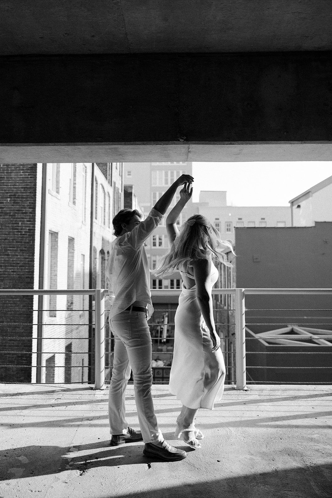 hannah-and-trey-parking-can-be-fun-downtown-memphis-river-walk-mississippi-beach-tennessee-wedding-photographer-jo-darling-photography-4.jpg