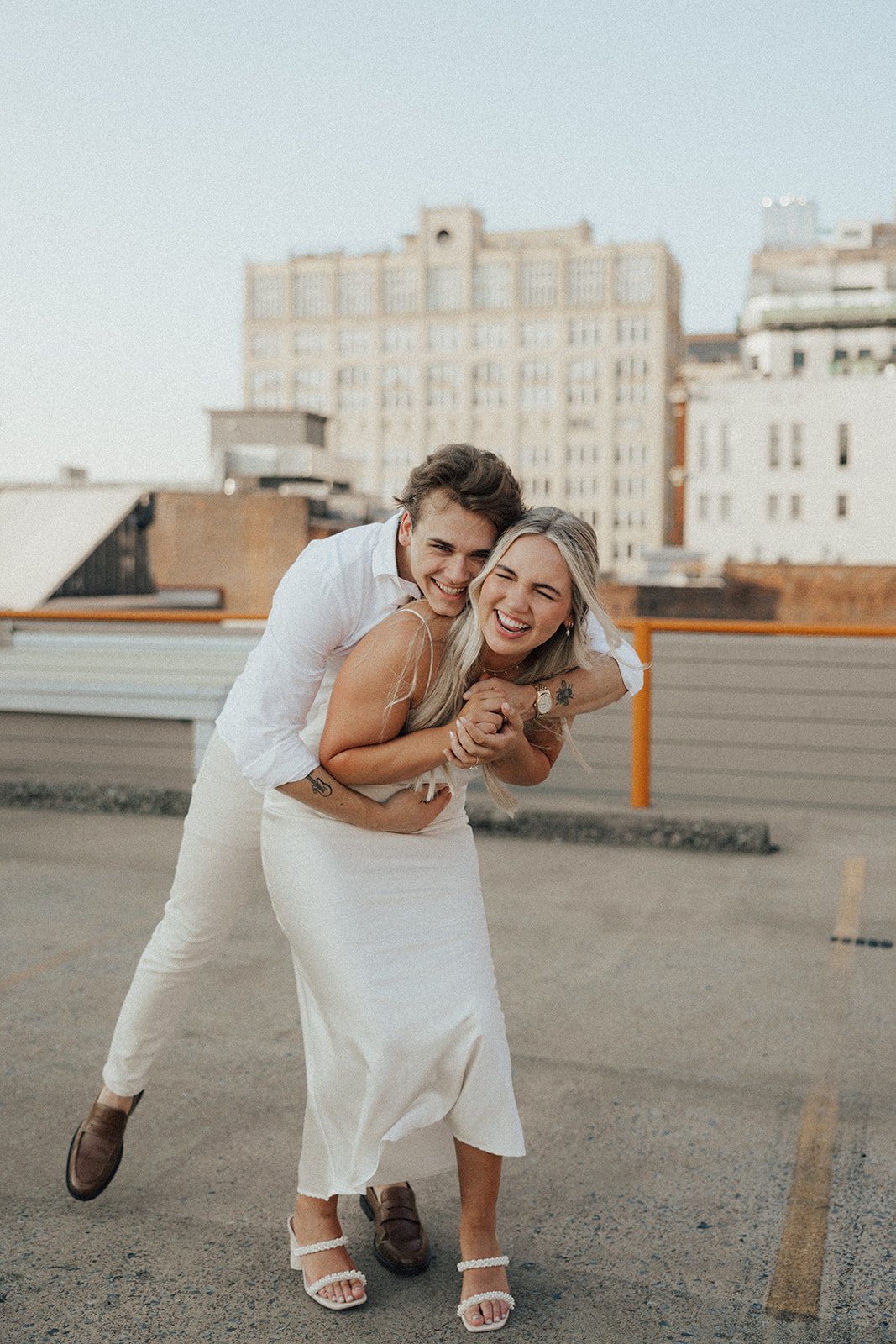 hannah-and-trey-parking-can-be-fun-downtown-memphis-river-walk-mississippi-beach-tennessee-wedding-photographer-jo-darling-photography-73.jpg