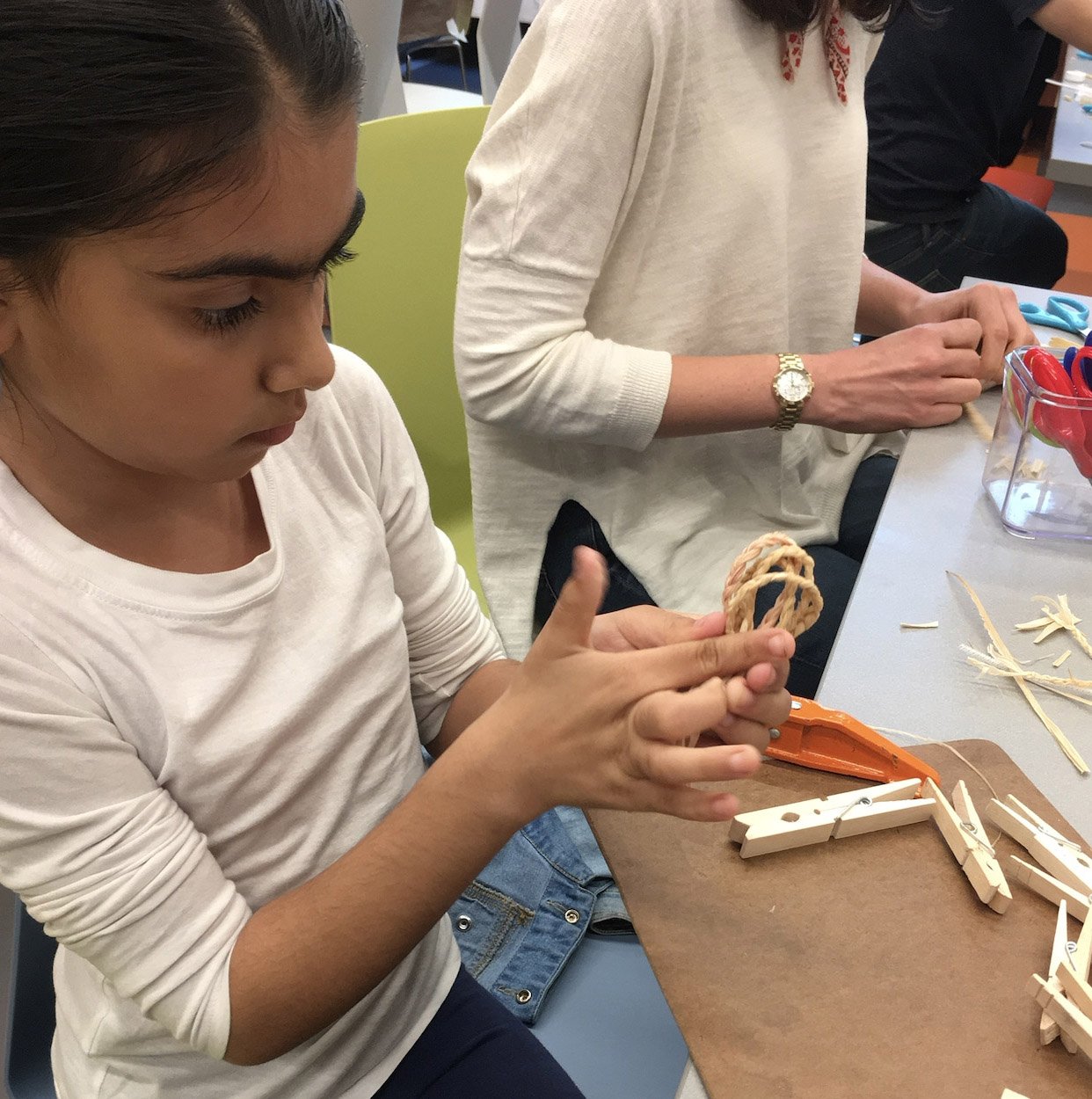  Participant in a corn husk material exploration workshop at the National Museum of the American Indian 