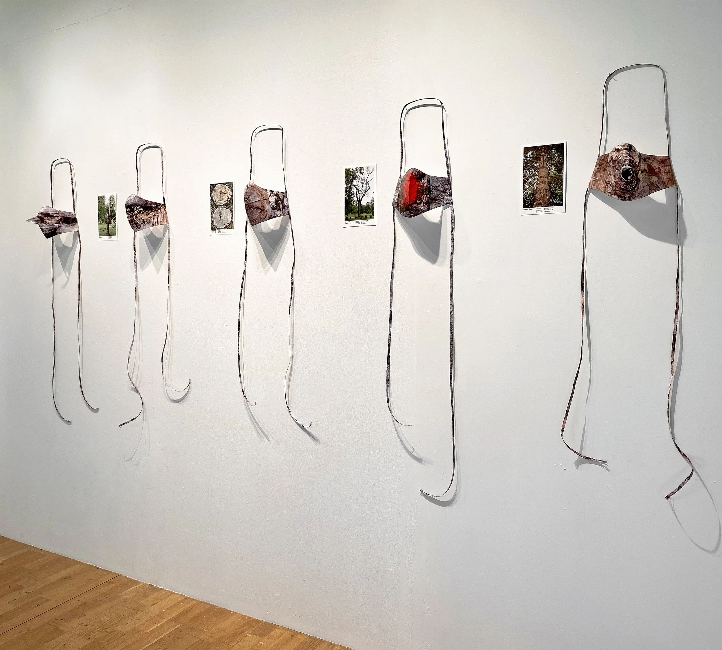 Meta Mask , 2020, digital photocopies, glue, colour pencil, 110 x 29 x 14 cm (each individual mask) exhibition at AllArtNow Lab installation photo by Katarina Eismann