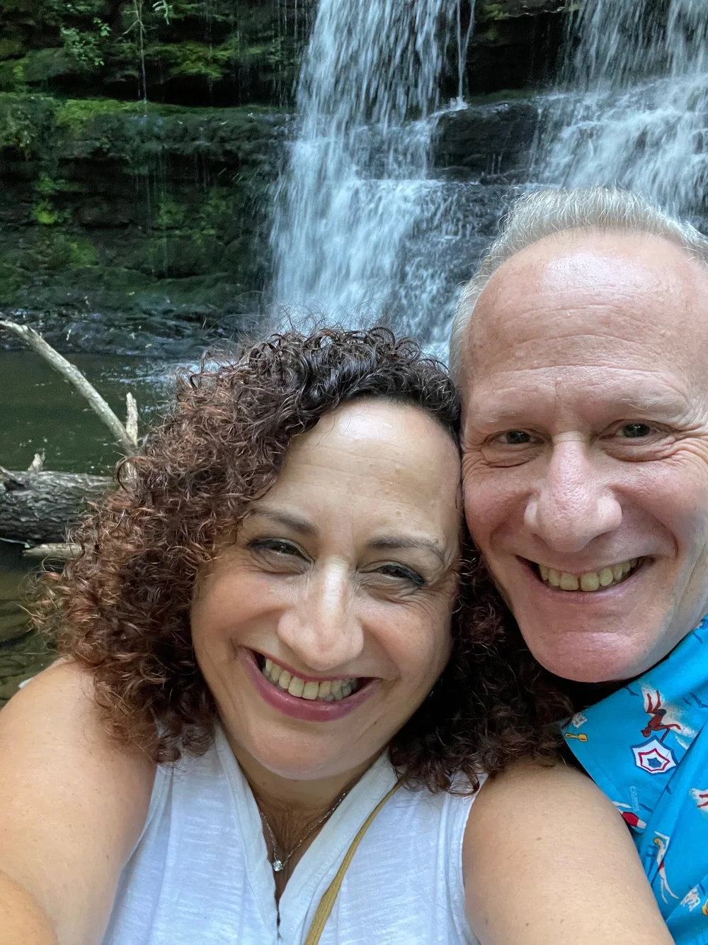 Linda and Steve at the waterfall - A Tiny House Resort