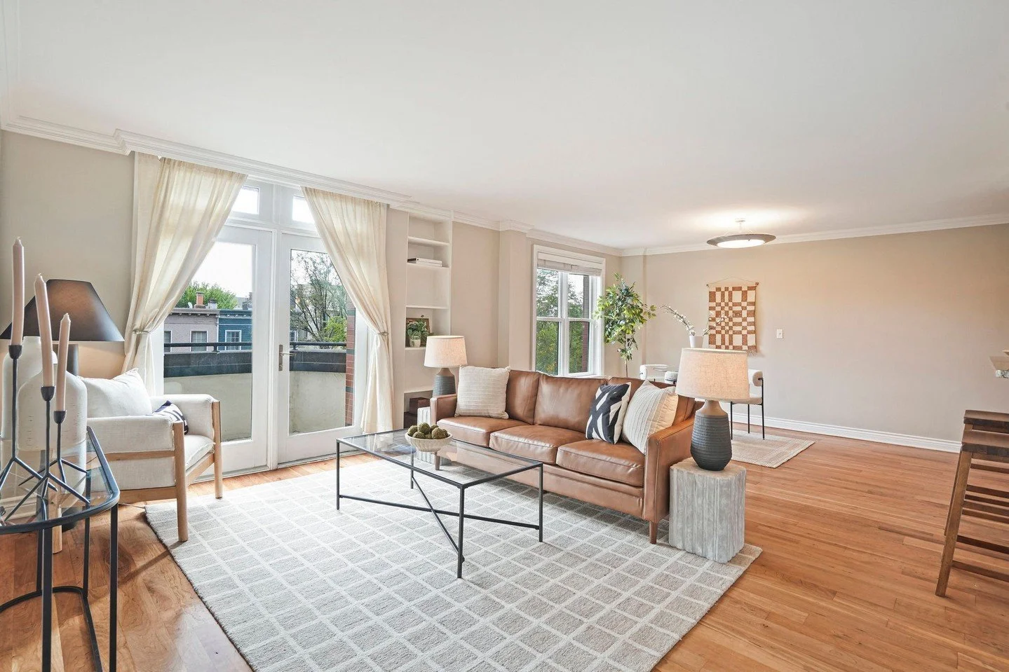 The natural light in this condo is iconic &mdash; so of course I had to keep everything light, bright, and totally effortless.

I brought in a low, modern leather sofa to keep the space feeling open (because nothing says &ldquo;buy me&rdquo; like roo