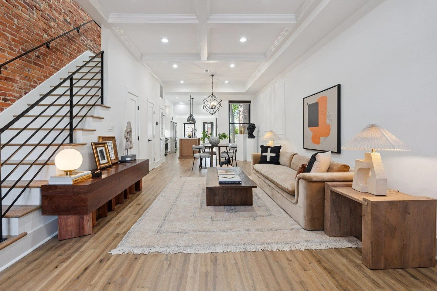 This house said, &ldquo;Give me warmth and drama&mdash;I can take it.&rdquo; So&hellip; I did.

I kicked things off with a statement sofa that shows off the grand proportions of the room, then added textured pillows, earthy woods, and pops of black.
