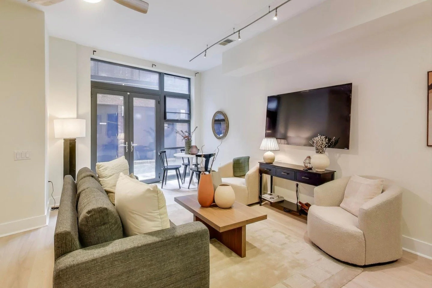 This condo has that classic Adams Morgan energy: character, texture, and just the right amount of architectural interest. It was a beautiful space already, it was my job to put the icing on top. 

I leaned into a palette that felt soft and grounded, 