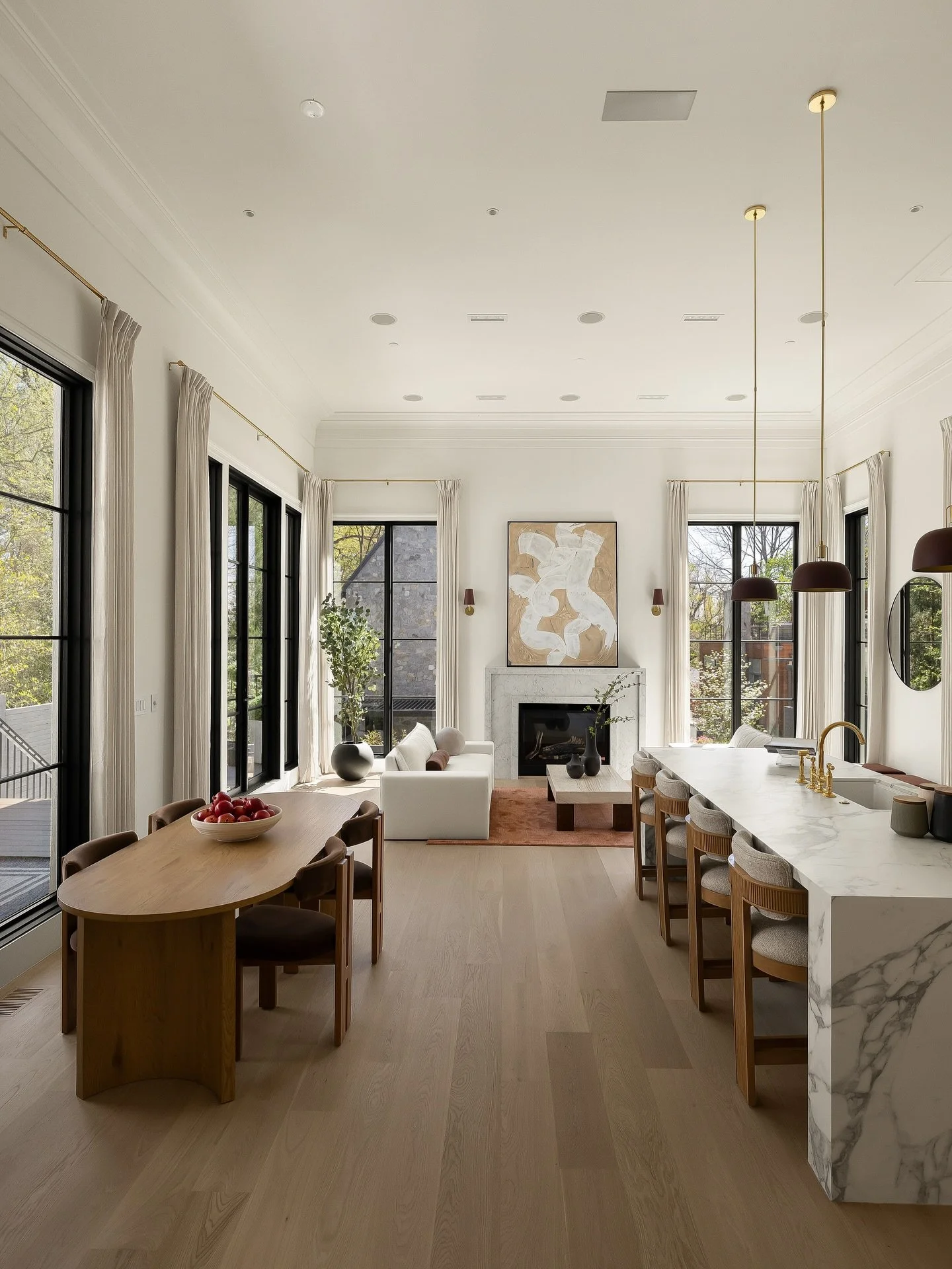 Now let&rsquo;s talk about the spaces that bring the entire main floor together.

The great room and dining room had to do a lot of heavy lifting &mdash; connecting seamlessly to the formal living room while still holding their own. In a home like th