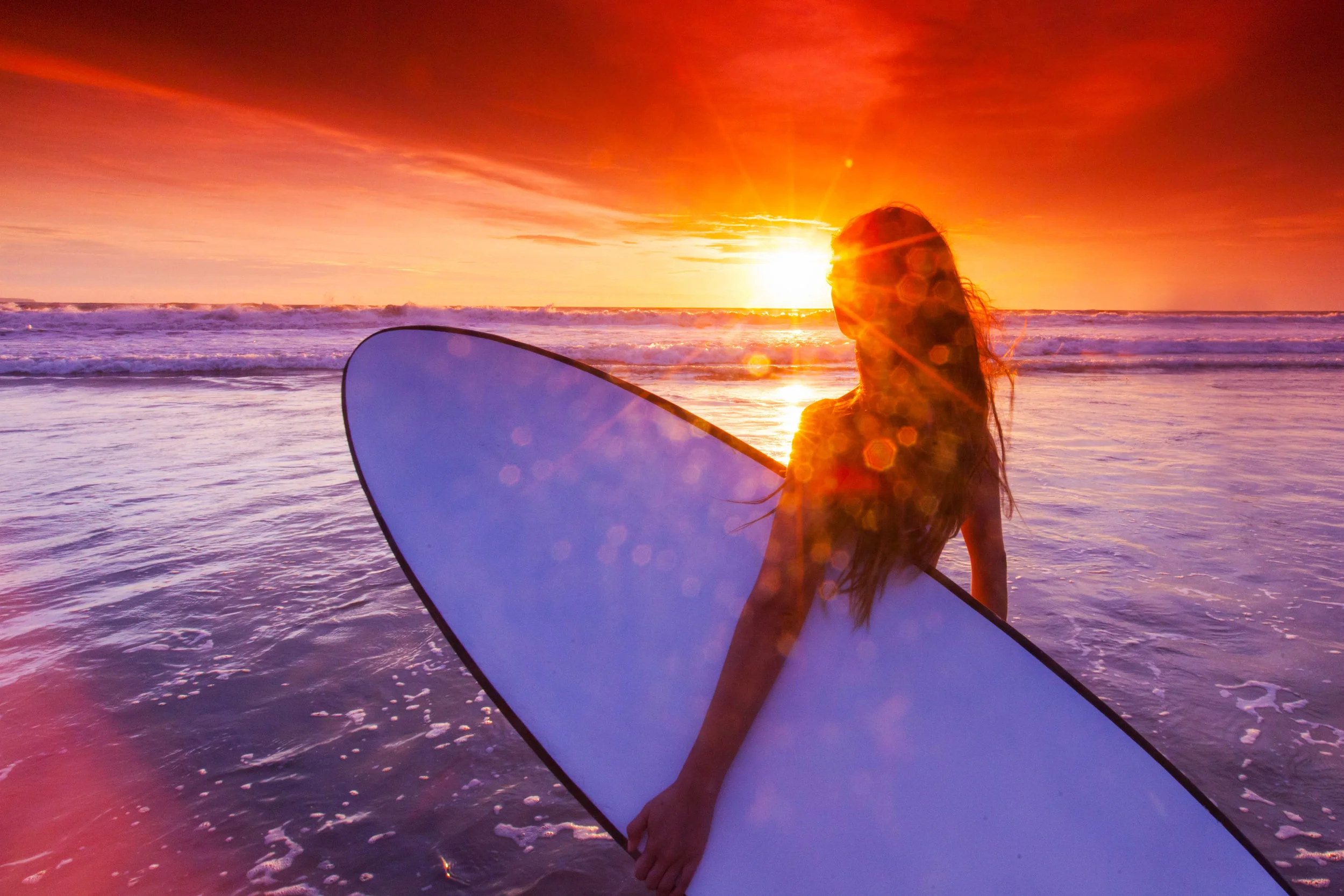 Woman with surfboard