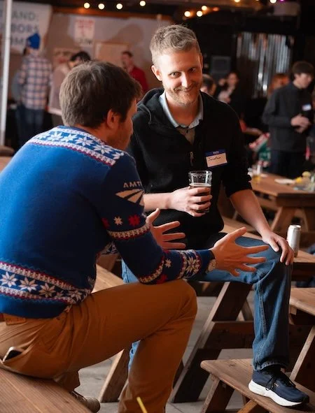 two Portland: Neighbors Welcome members talking and smiling