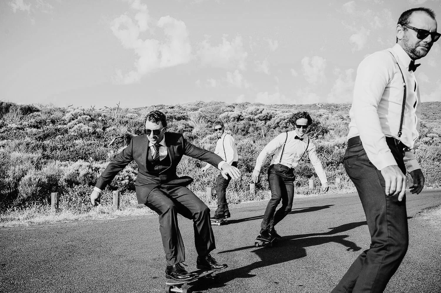 groomsmen skateboarding together