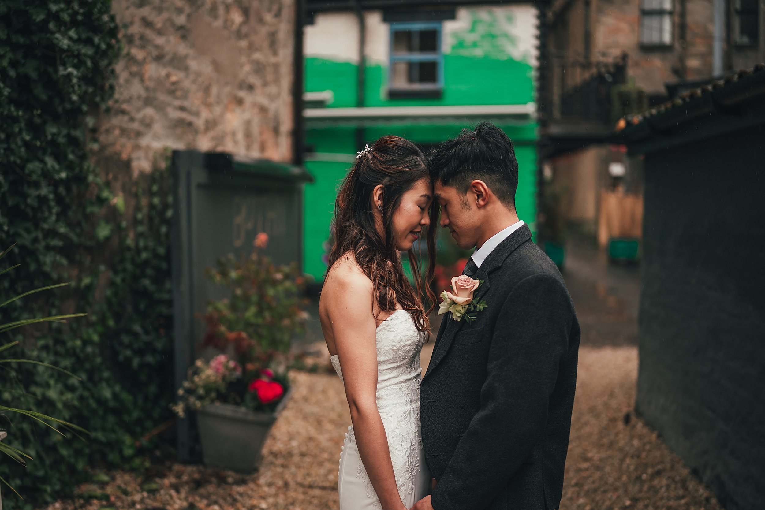 Bride and Groom sharing a moment in Ruthven Lane Glasgow at The Bothy after their wedding