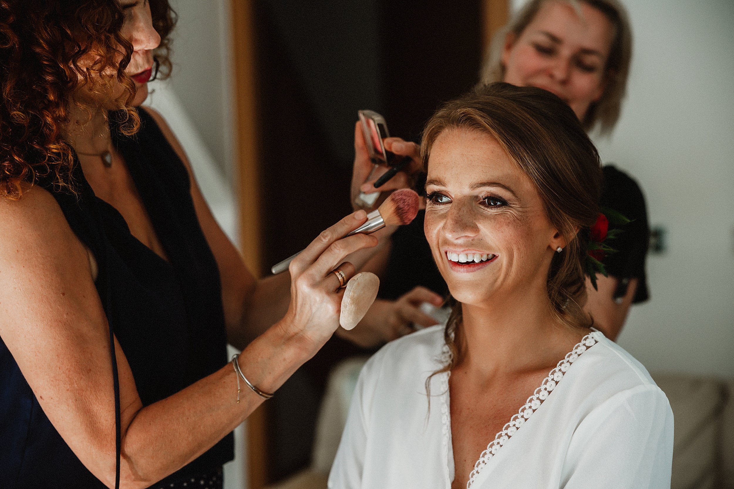 Bride getting ready in St Andrews old town on her wedding day at Kinkell Byre