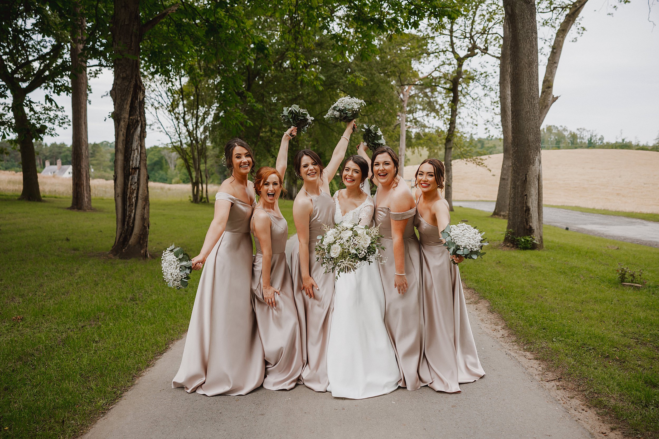 Bride and bridesmaids in grounds of Enterkine House Hotel on wedding day