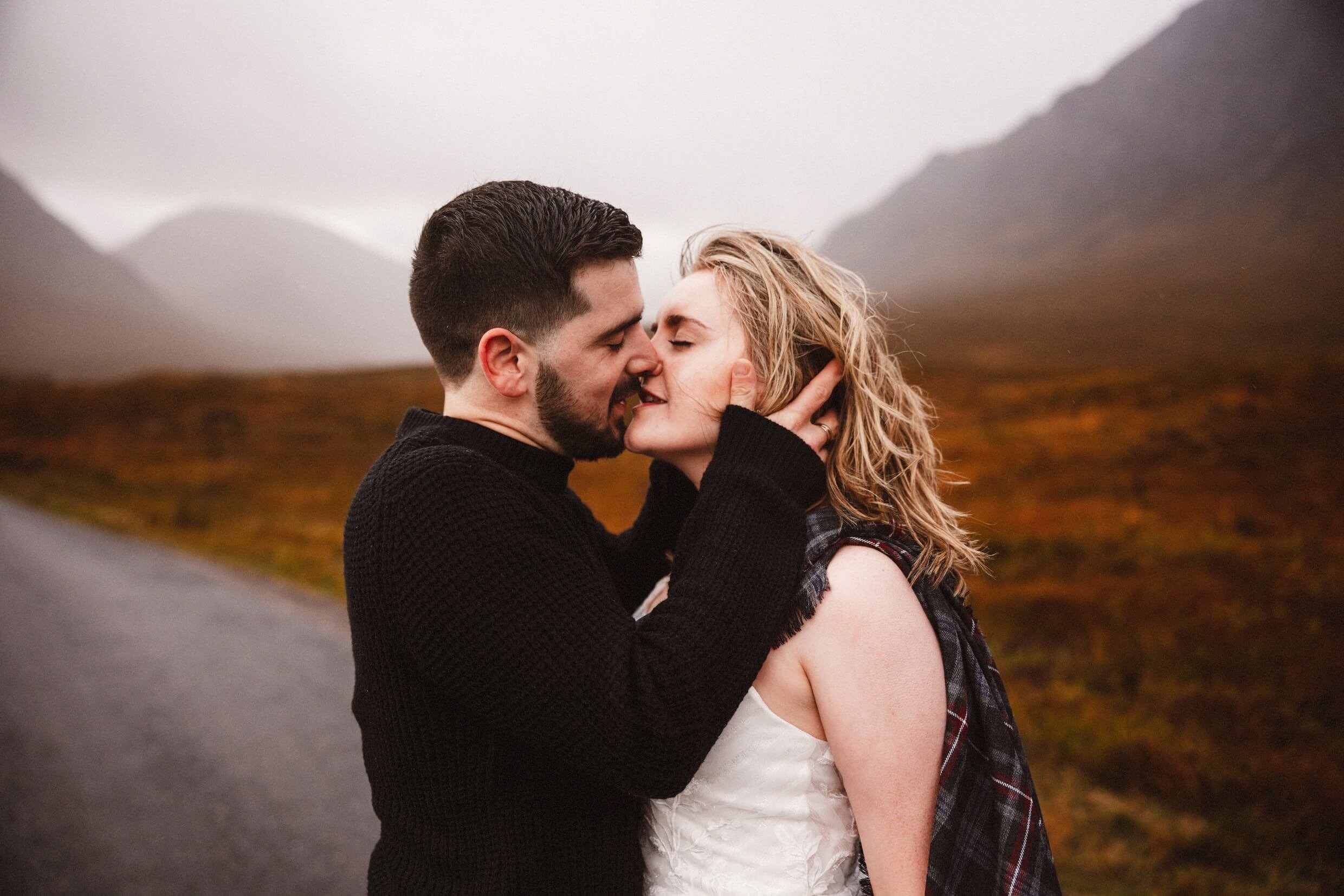 bride and groom kiss during glencoe elopement in glen etive scotland