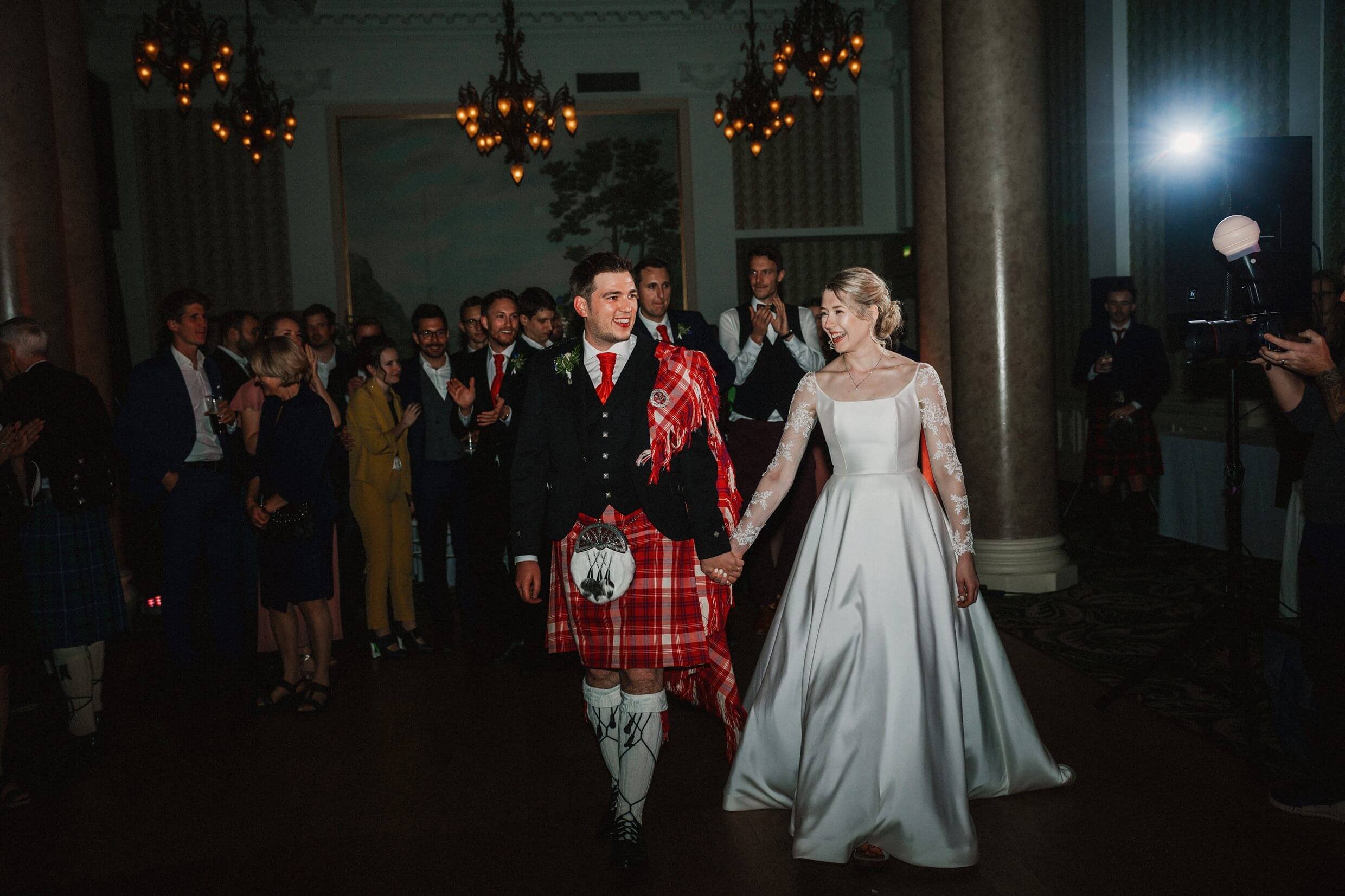 the bride and groom begin their first dance at the balmoral hotel edinburgh wedding venue in scotland