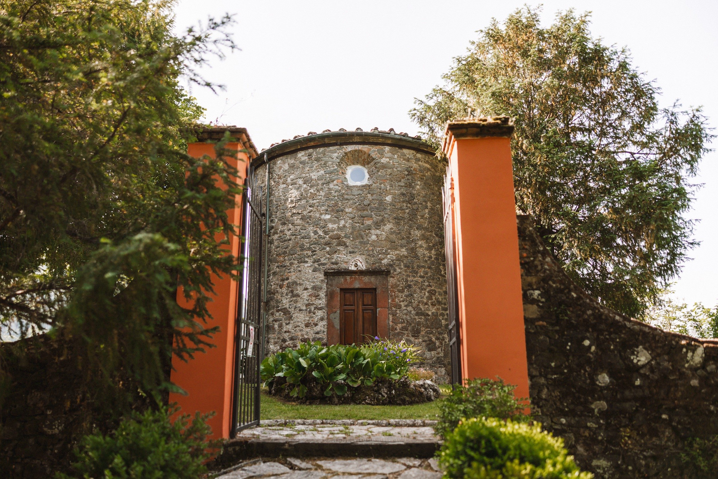 exterior view of private church at the agriturismo la torre italian destination wedding venue in bagni di lucca tuscany