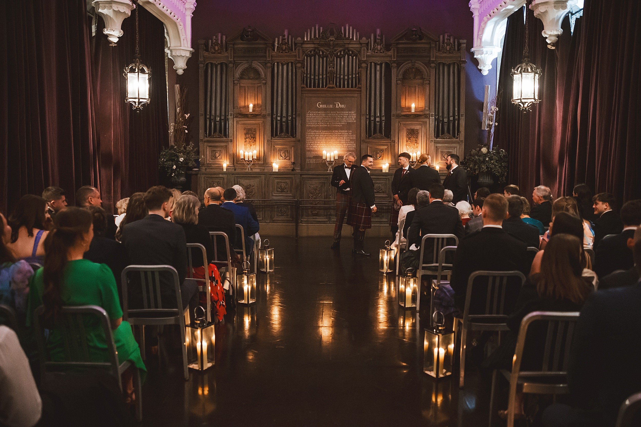 interior shot of unique wedding venue the ghillie dhu showing guests seated before the ceremony by documentary wedding photographer edinburgh