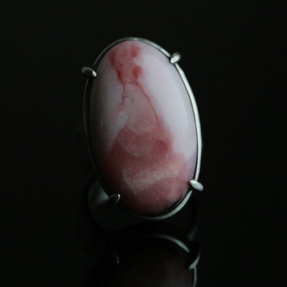 This ring features an all-natural pink opal, with an amazing colour patch. To me it looks like a formal papal attire, I call him &quot;The Pink Pope&quot;. The opal sits in a tight, minimal setting, on a textured, organic-looking band. Oxidised and p
