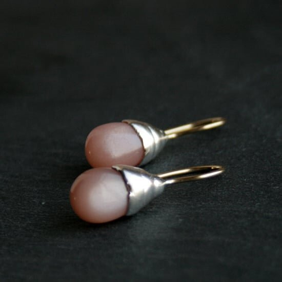 Beautiful silky peach moonstones drops set in sterling silver. I casted the silver settings from wax models made around the stones. The casts are not identical, as each one is individually handmade. 
Available in my shop, click on linkin bio for more