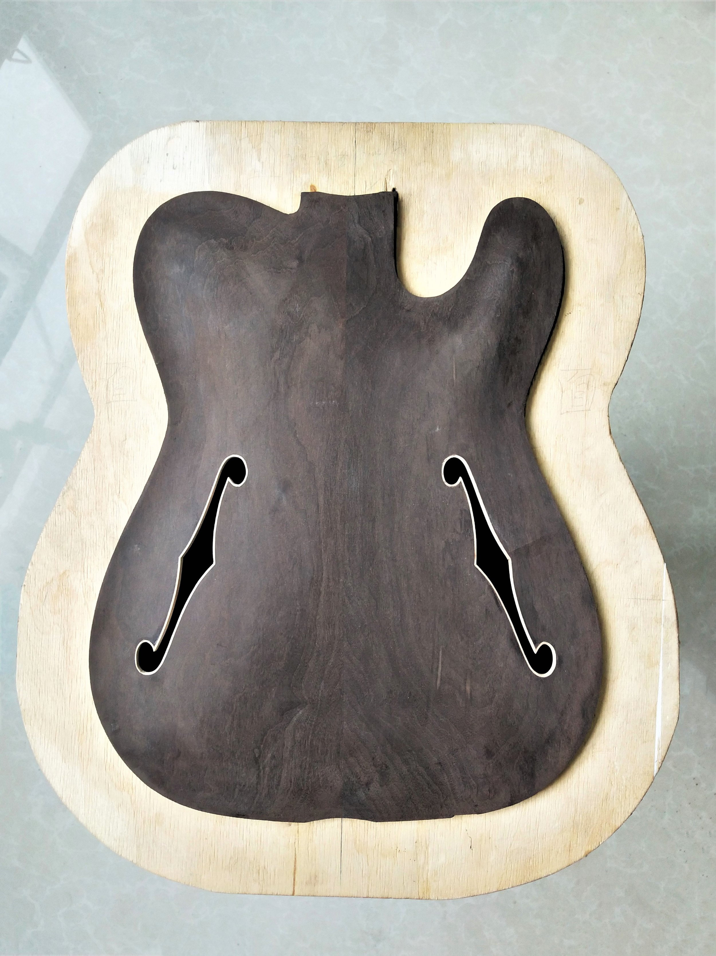 Dejawu Guitars - top with carved f holes