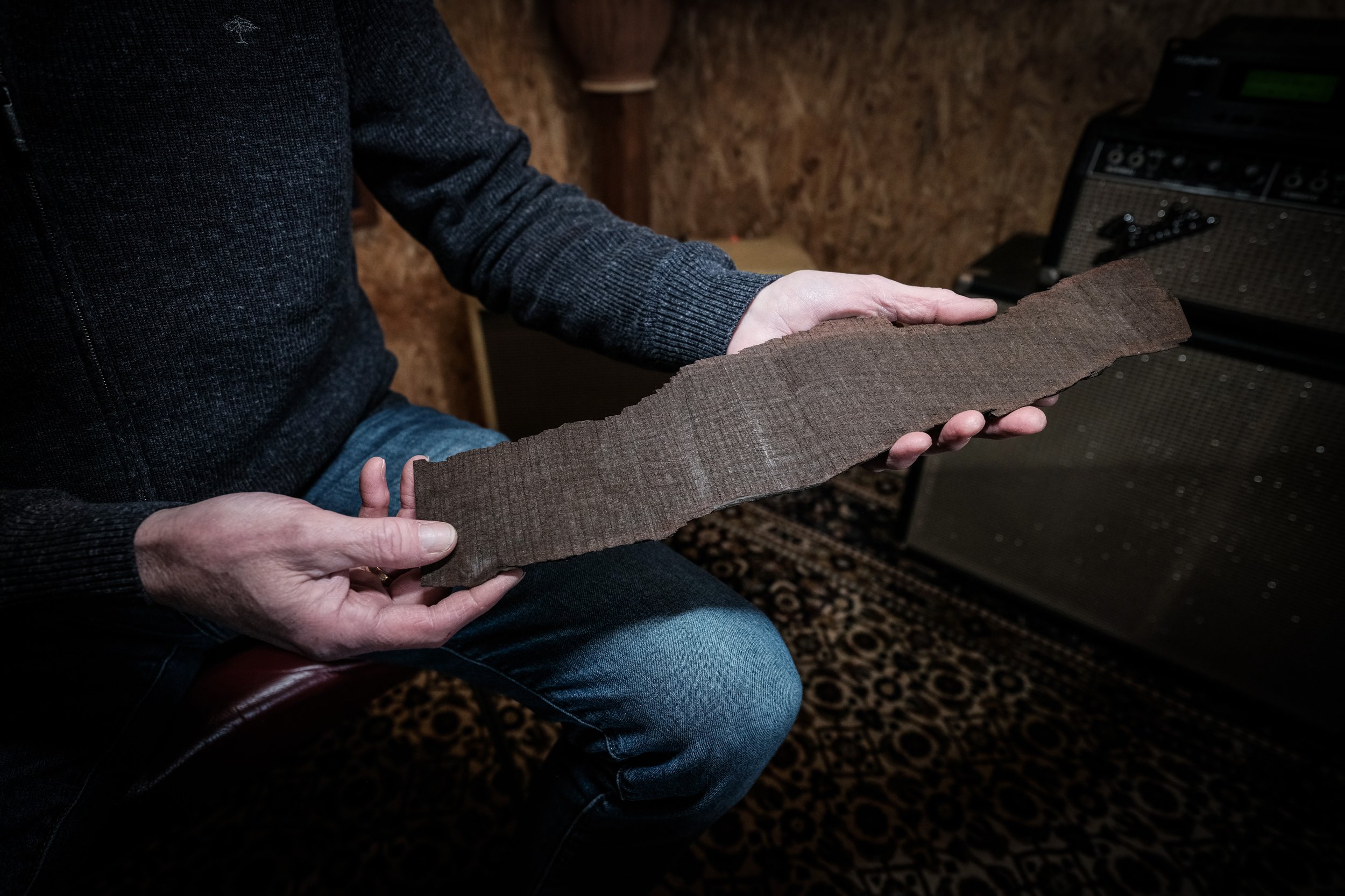 Dejawu Guitars - Derk Jan Lievers holding a piece of 7500-year-old sinker wood.