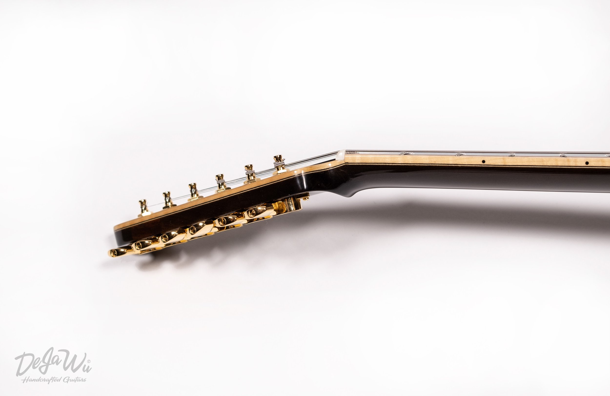 Dejawu Guitars - Hand carved semi hollow guitar from 7500-year-old sinker wood.