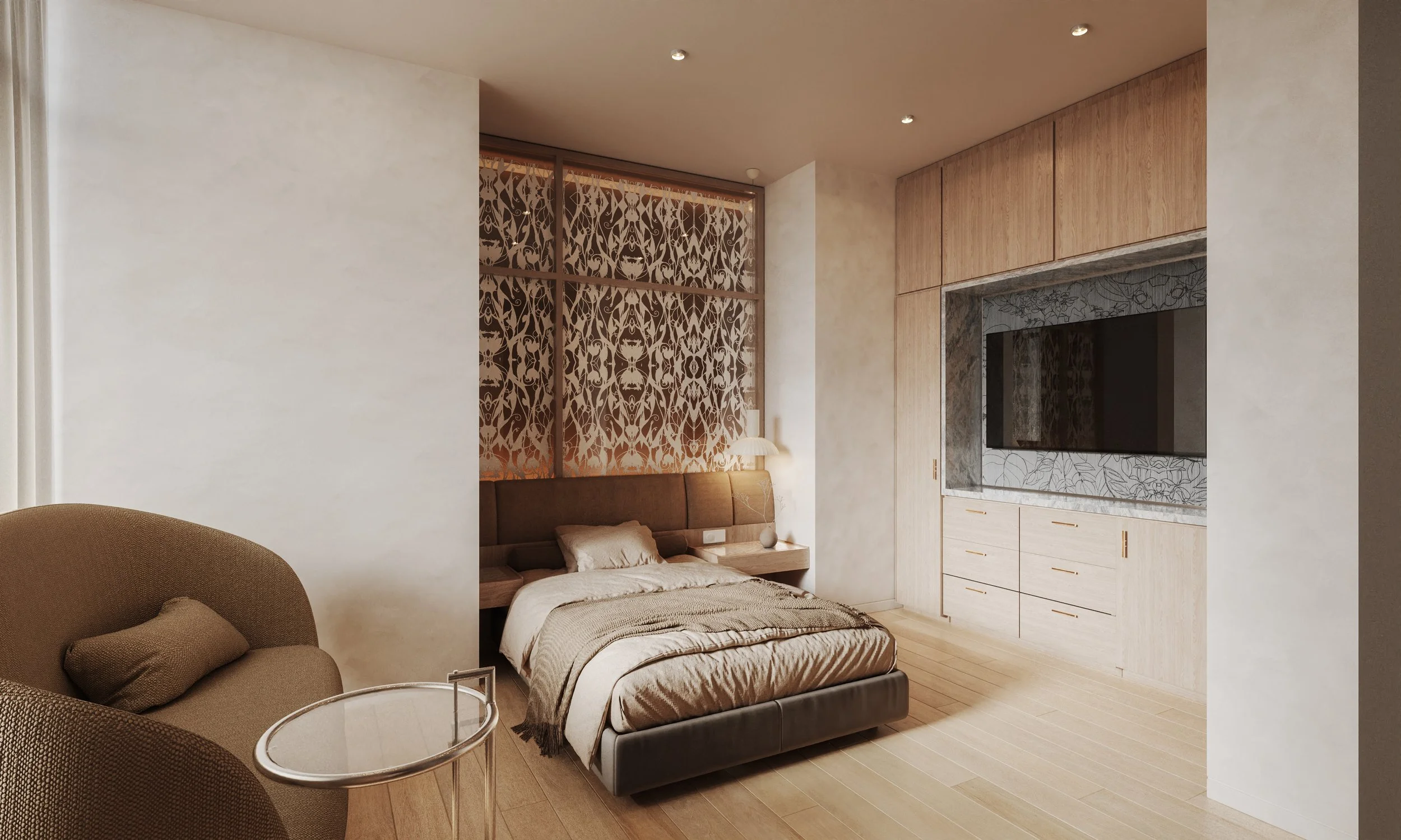 Aeternum Design Studio, wellness, hospitality, hotel. A modern bedroom with a bed, nightstand, lamp, beige armchair, and wooden cabinetry surrounding a flat-screen TV, with a decorative window screen.