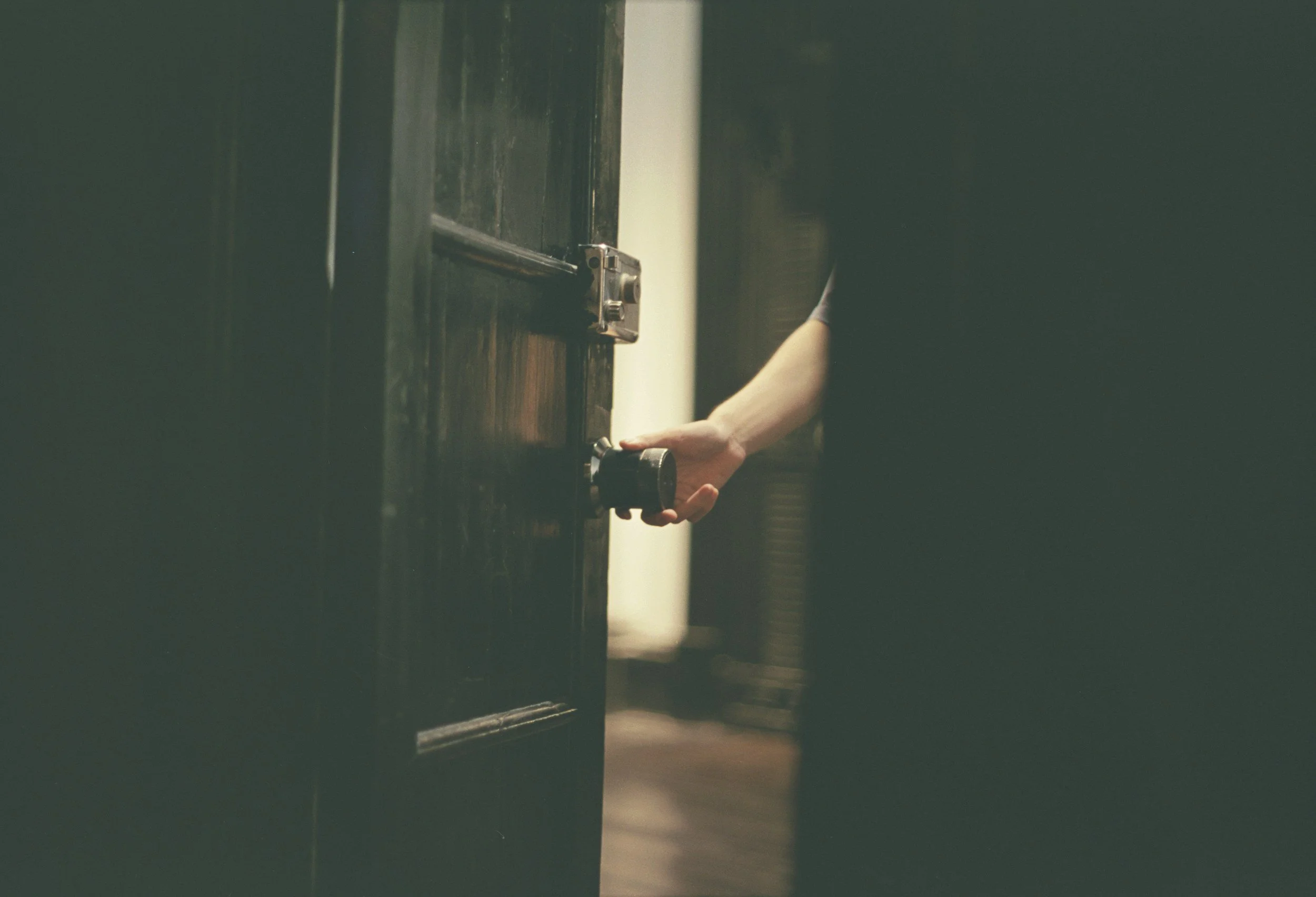 Hand opening door to light — OCD therapy Northern Virginia