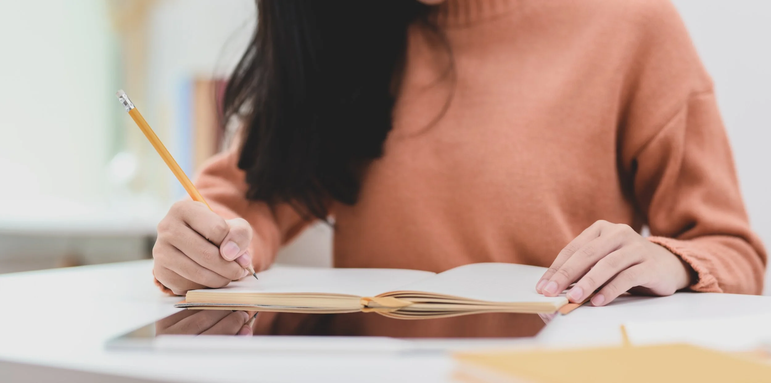 photo-of-woman-writing-on-notebook-3751530.jpg