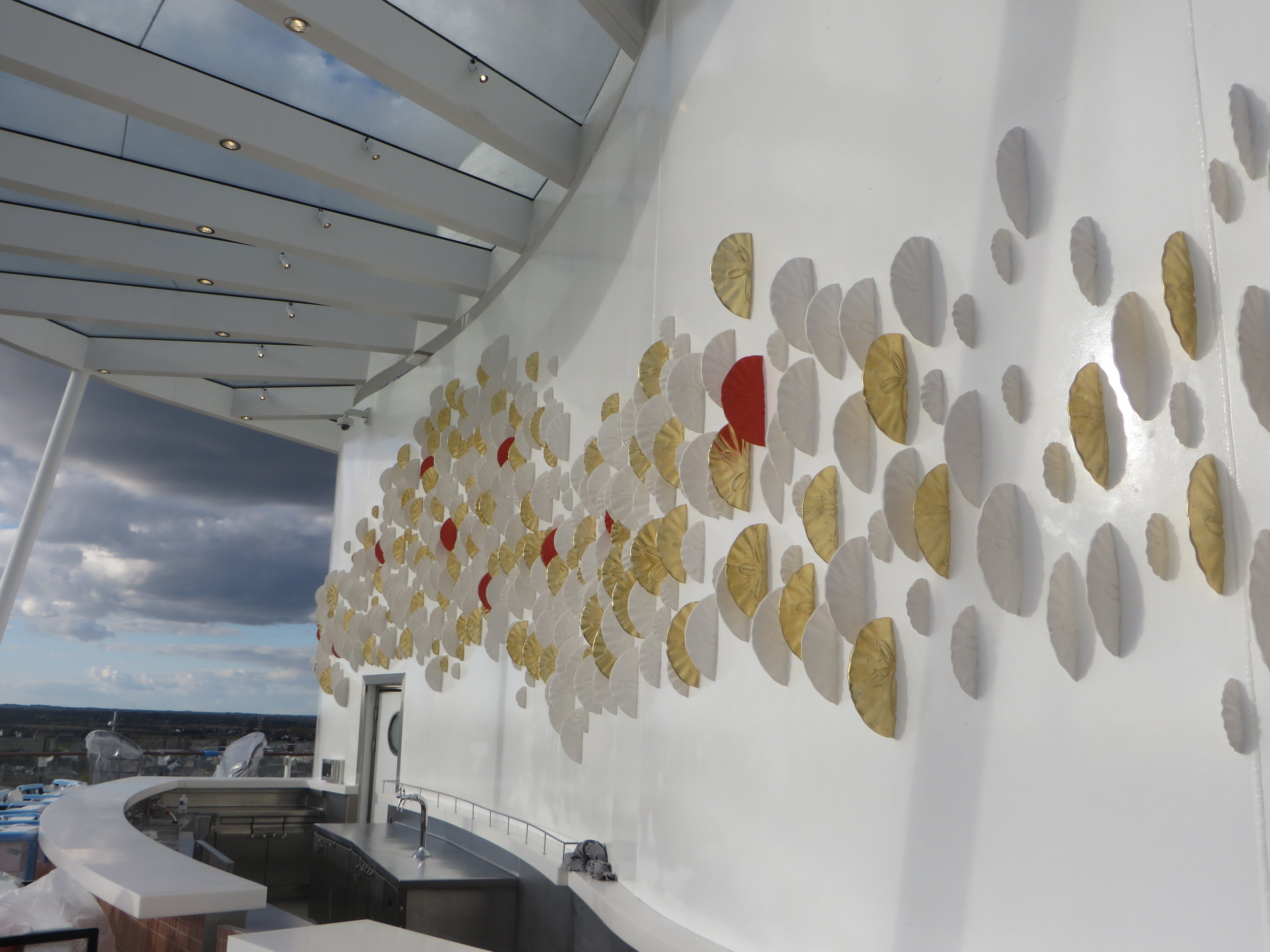 Sand Dollar installation on ship facade