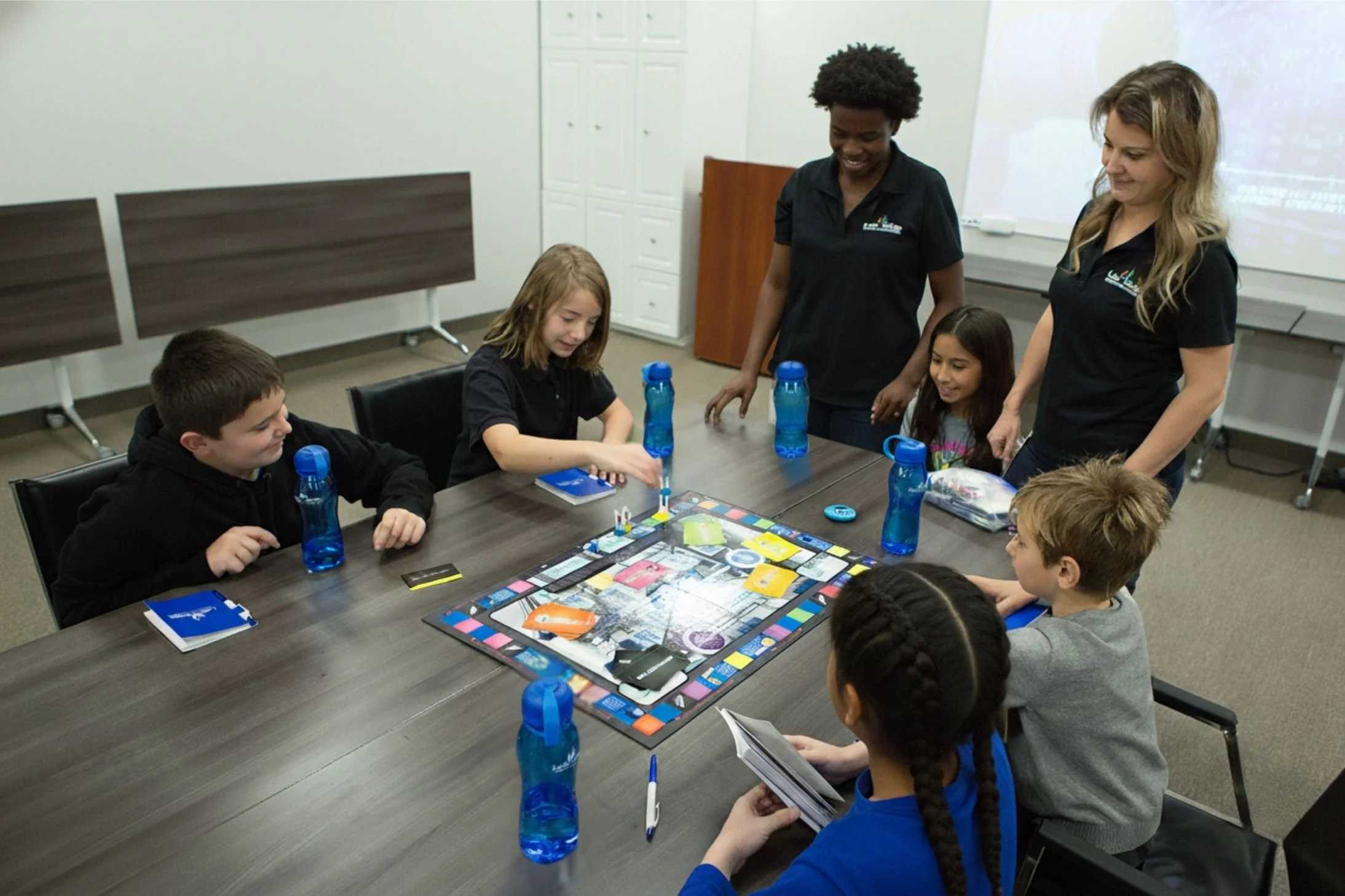 Group program featuring kids playing board games.