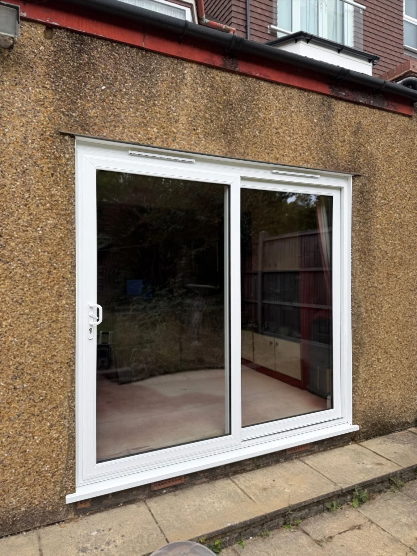 oakwood-sliding-door-white-upvc-exterior.jpg