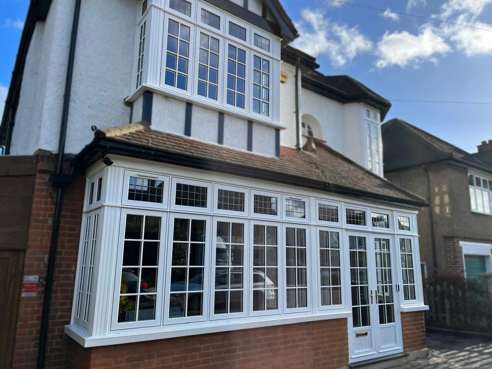 White uPVC porch and bay window installed by Oakwood Windows in North London