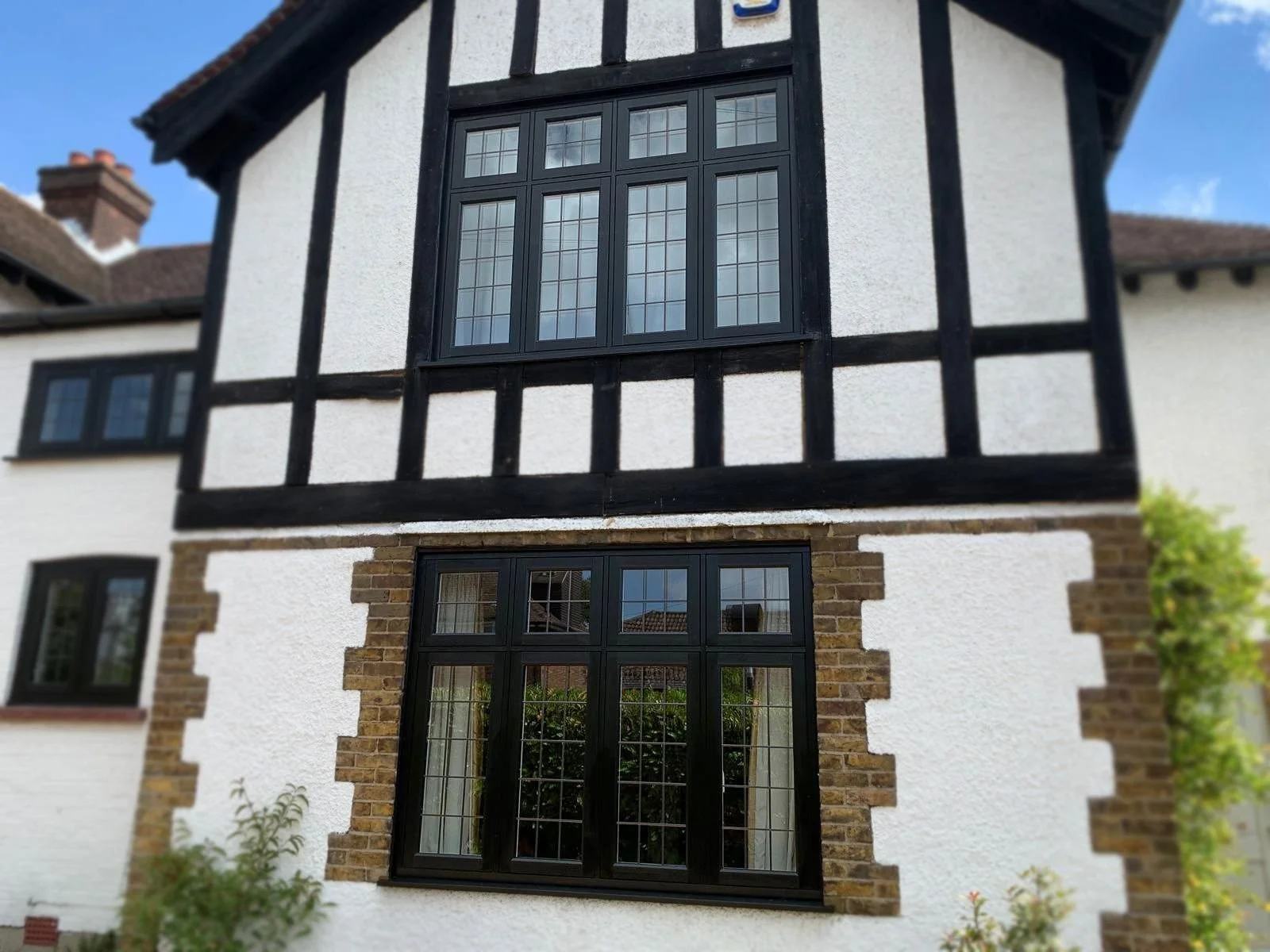 Black aluminium windows on a Tudor style house in North London, fitted by Oakwood Windows