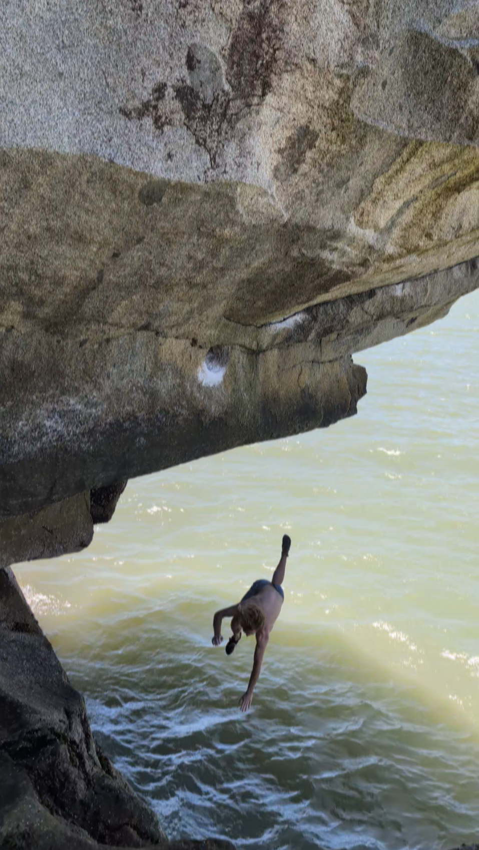 Michael Kulakovsky climbing above the water