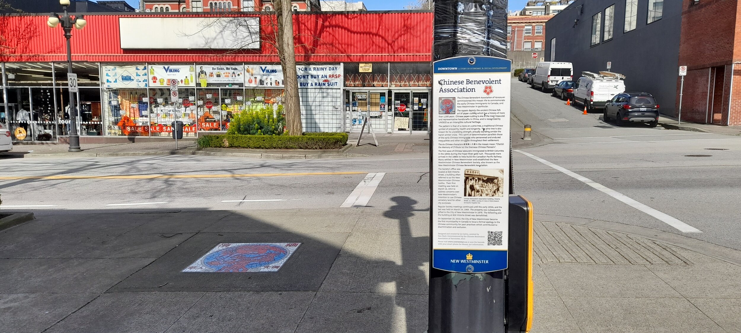 Mosaic on sidewalk and vertical description