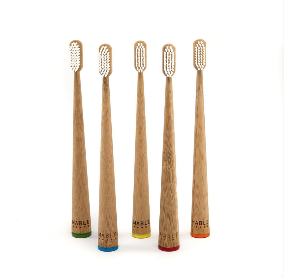 Eco-friendly bamboo toothbrush set by MABLE, showcasing sustainable dental care with stylish design and natural materials.