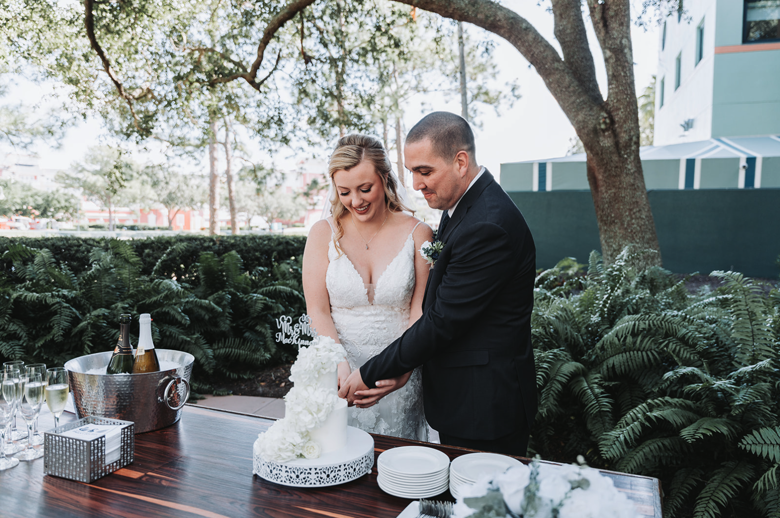 Cake and champagne celebration after intimate Swan and Dolphin wedding ceremony.