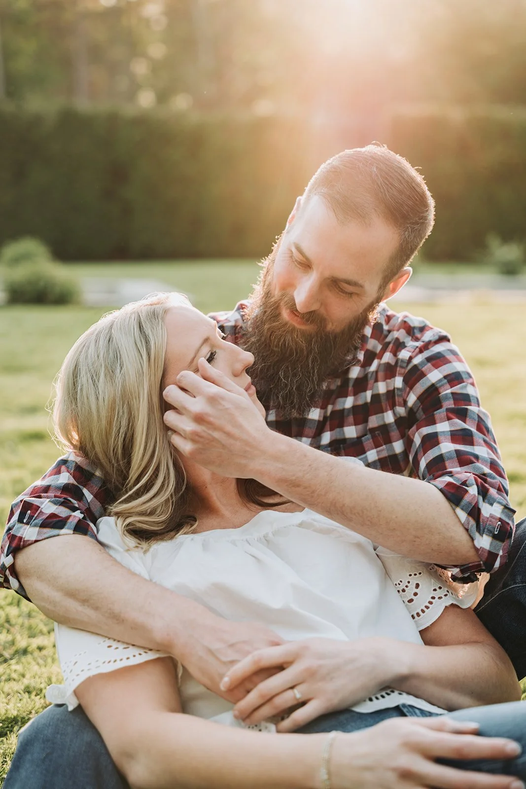 mount-assisi-gardens-engagement-tucking-hair.jpg