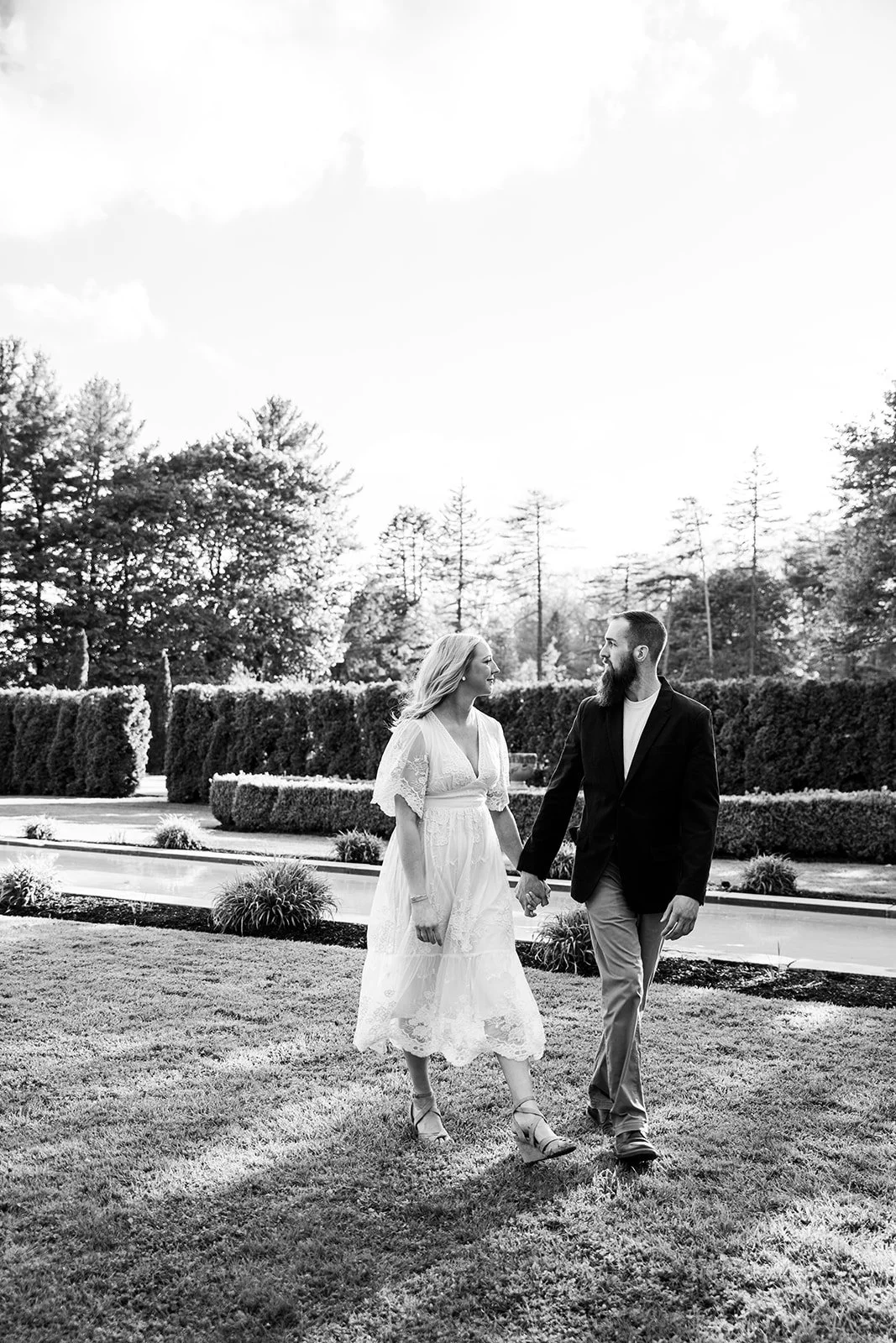 mount-assisi-gardens-engagement-hand-holding-walking.jpg