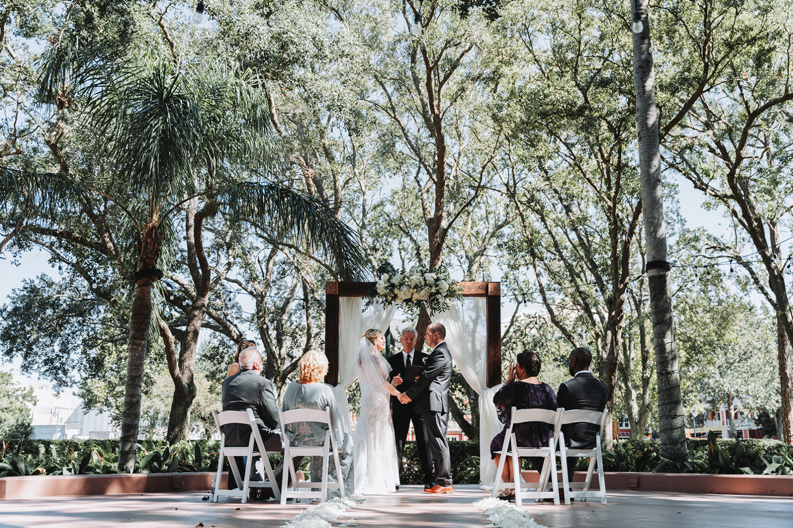 Intimate wedding ceremony at Crescent Terrace Walt Disney World Swan Resort in October.