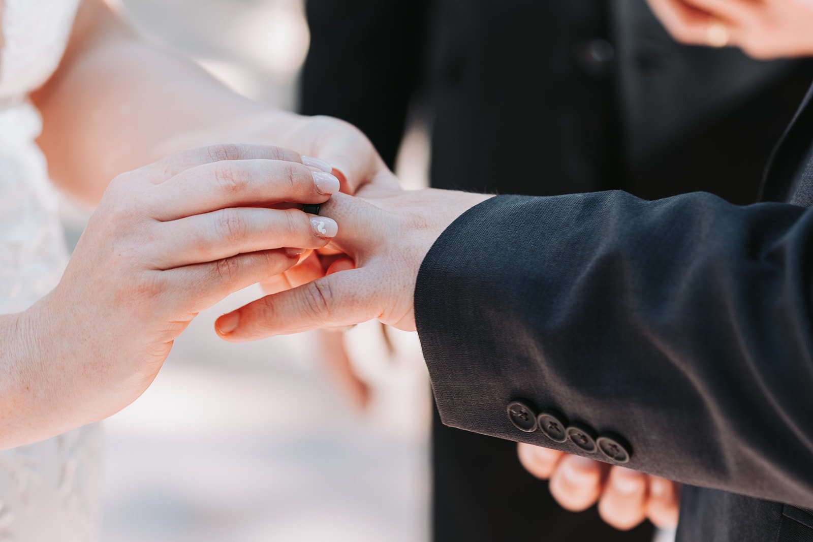 swan-dolphin-wedding-ring-exchange.jpg