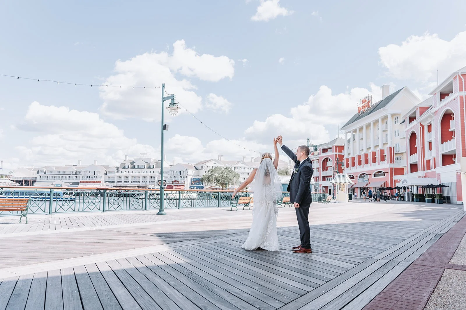 Disney BoardWalk waterfront wedding portraits during Swan and Dolphin wedding day.