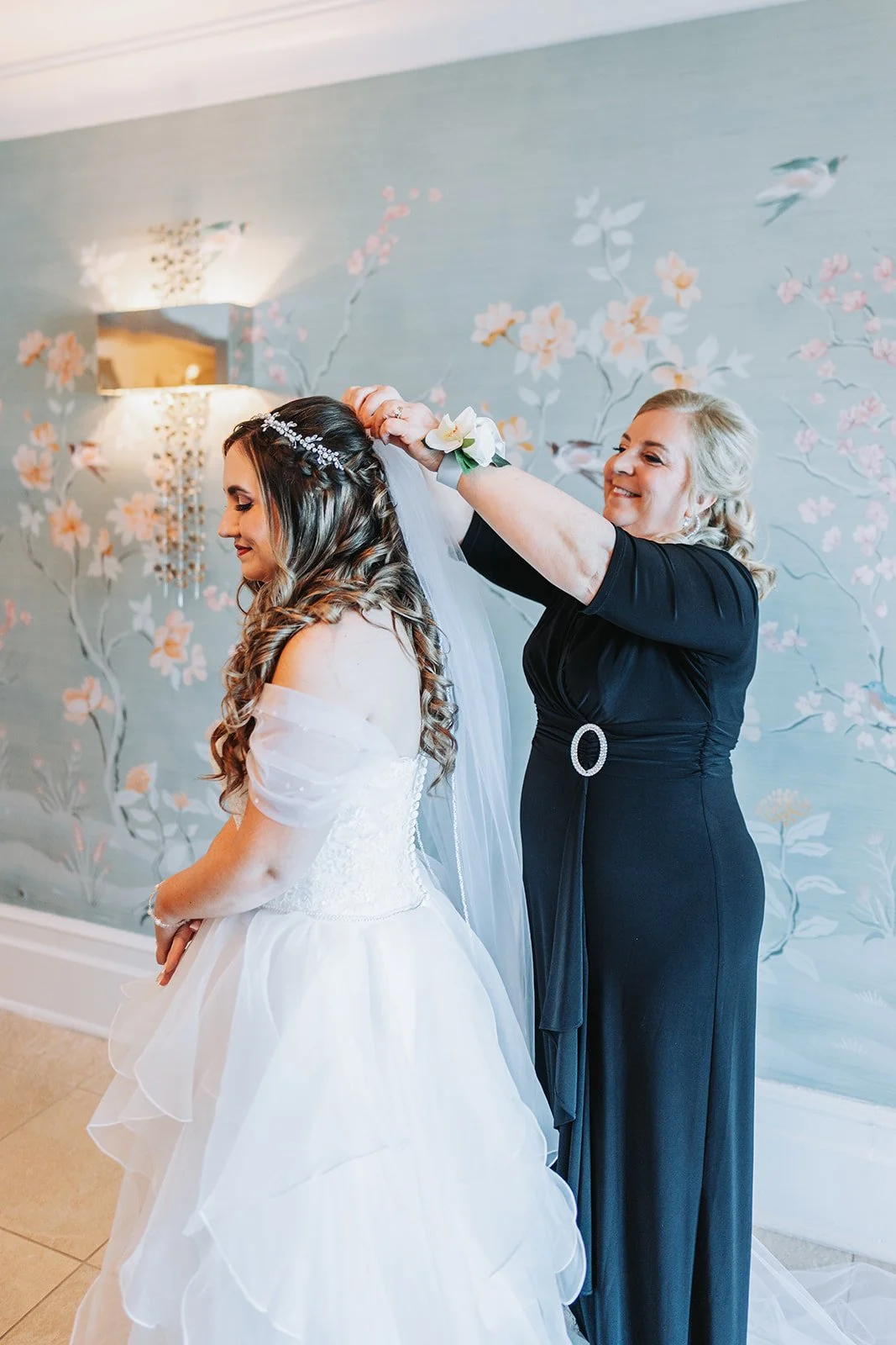 bride-get-ready-mom-places-veil-disneys-grand-floridian-wedding.jpg