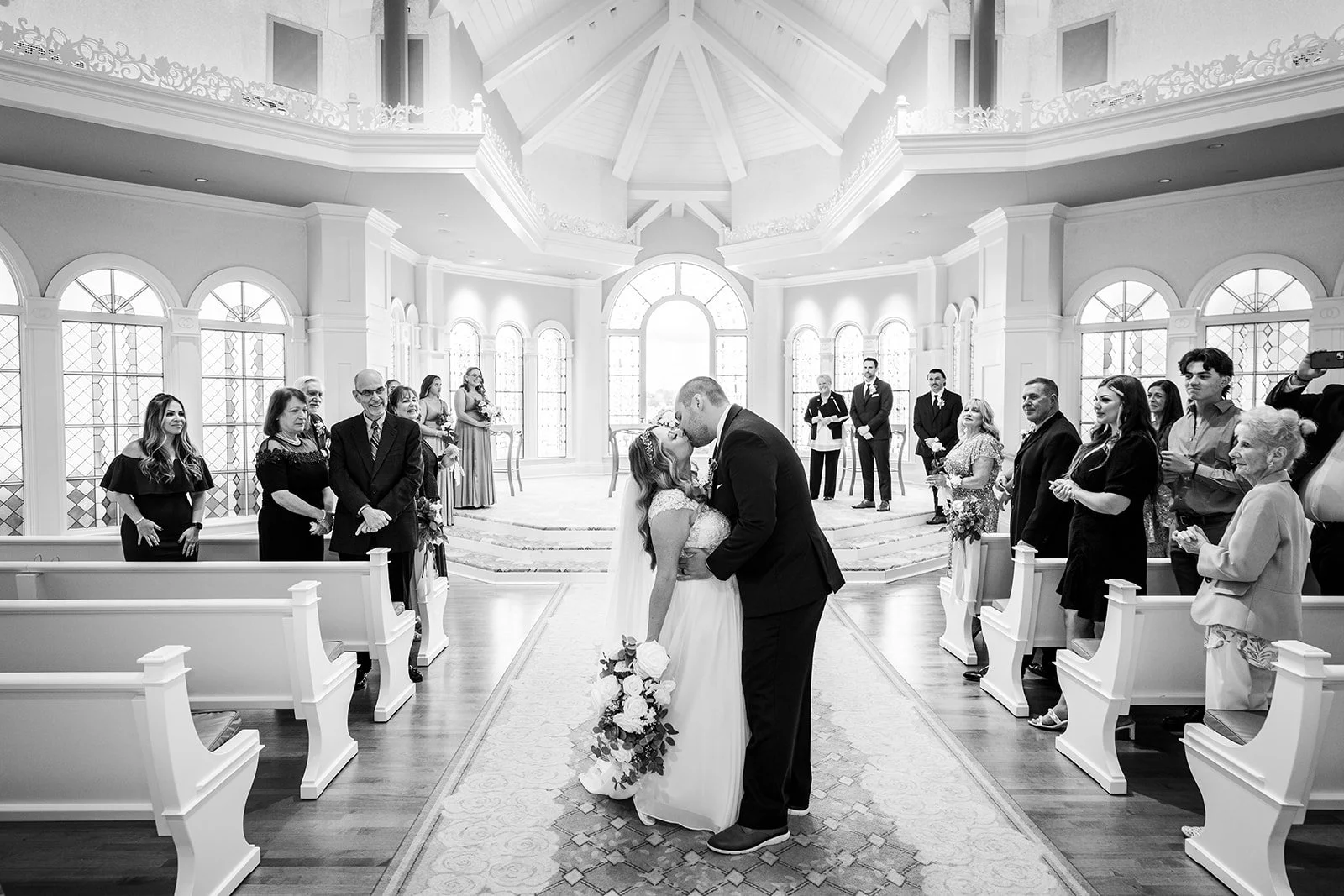 Couple sharing kiss inside Disney's Wedding Pavilion at Walt Disney World in November.
