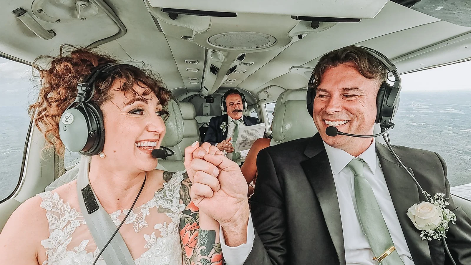 Aviation themed wedding ceremony inside airplane in Pennsylvania.