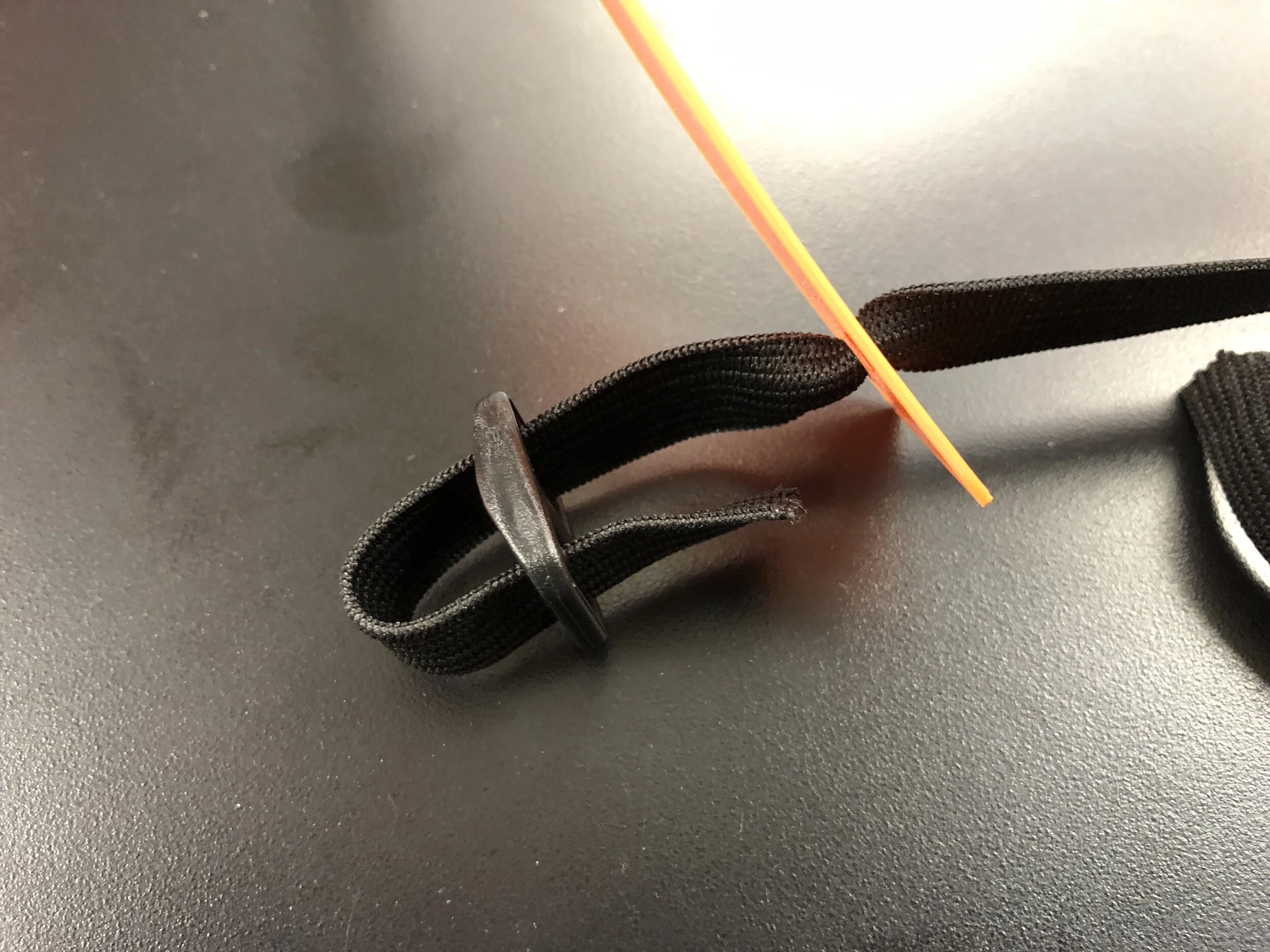 3: Loop One End of Elastic Through Buckle